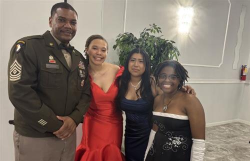 JROTC teacher and students posing